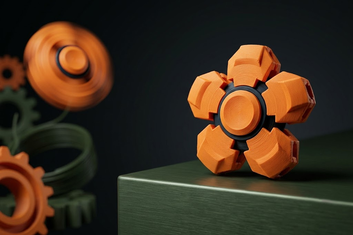 Orange pocket fidget spinner on a green surface